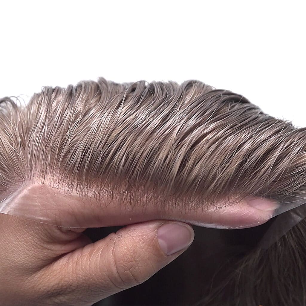 transparent base along the front hairline of thin skin hair systems 