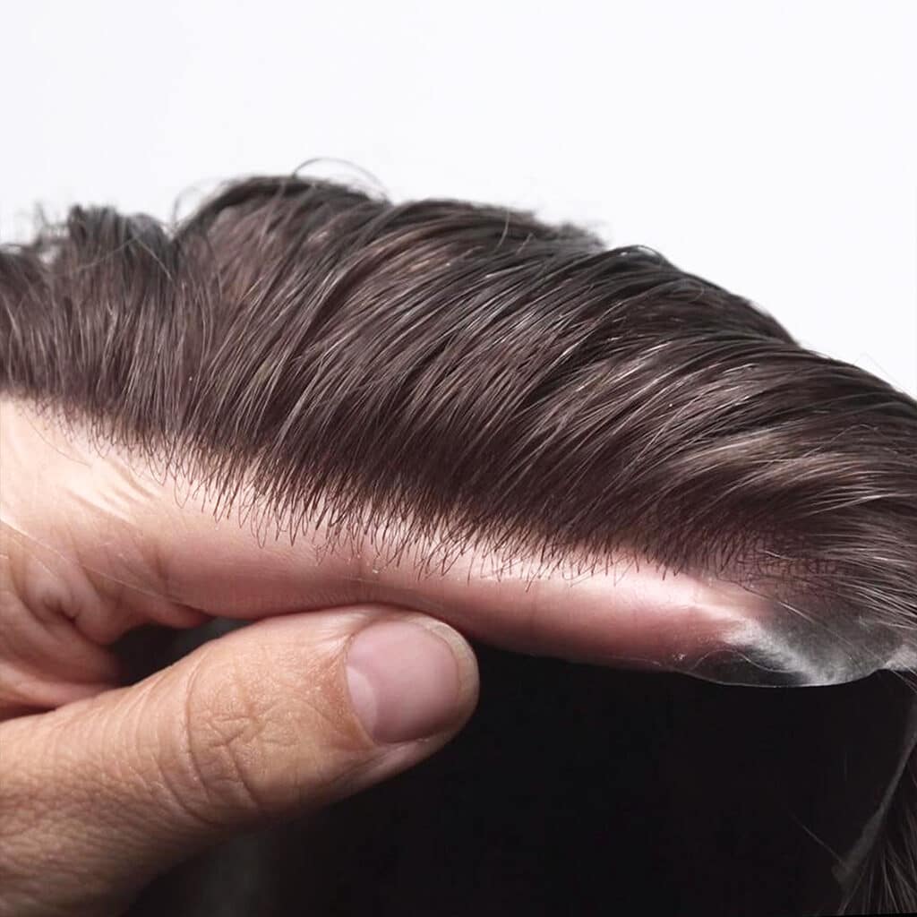 A thin skin hair system with a realistic hairline 